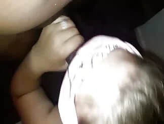Blindfolded cutie sucks a black cock