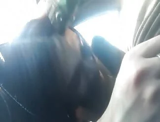 She gives a great blow to a black dick in a car