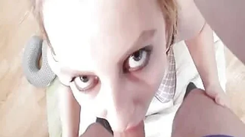 Filthy girl gags on her hand before sucking a cock