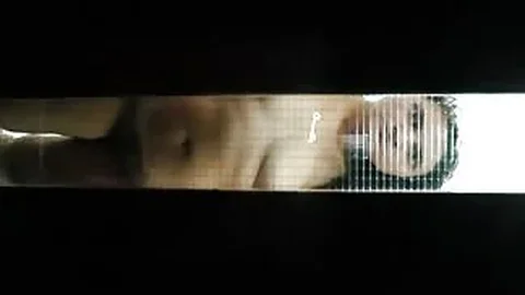 Nude woman behind glass