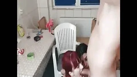 Brunette and redhead give an amazing double blowjob