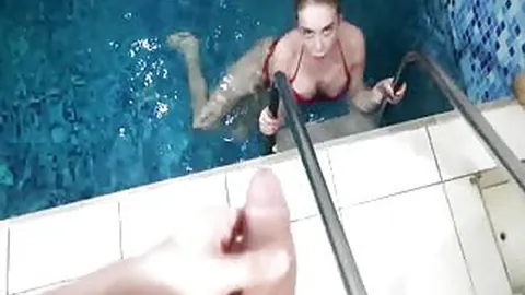 Hottie sucks dick and swallows cum in a pool