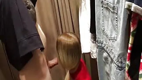 Cute girl sucks dick in a changing room